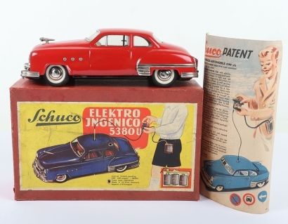 Schuco Ingenico 5380U Limousine Car, red clockwork and battery operated (untested) lithographed and painted tinplate two-door Limousine circa 1952, in very good used original condition, with battery pack (some rusting) and hand steering wire, bonnet masco
