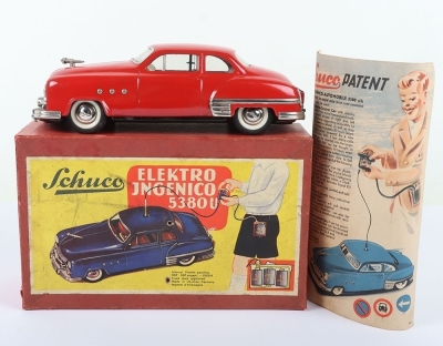 Schuco Ingenico 5380U Limousine Car, red clockwork and battery operated (untested) lithographed and painted tinplate two-door Limousine circa 1952, in very good used original condition, with battery pack (some rusting) and hand steering wire, bonnet masco