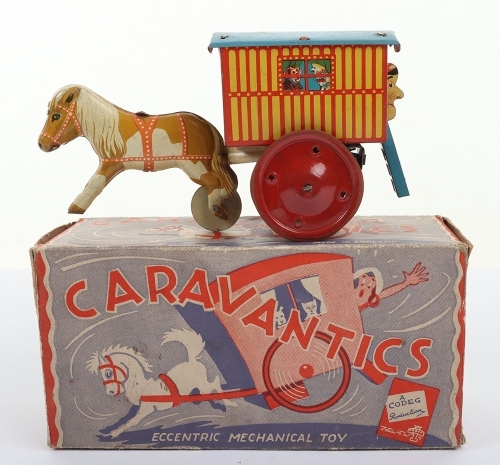 A Boxed Codeg Product (England) Tinplate Caravantics Eccentric Mechanical Toy