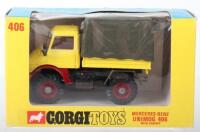 Corgi Toys 406 Mercedes-Benz Unimog 406 With Canopy,yellow/red body, red interior, olive detachable canopy, blue/yellow window display box, in mint original condition.