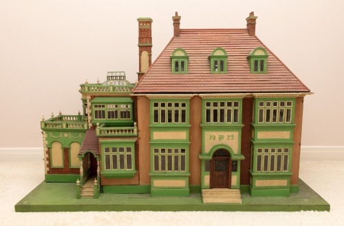 A large and architecturally impressive Victorian style Dolls House, English 1922,