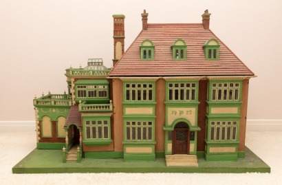 A large and architecturally impressive Victorian style Dolls House, English 1922,