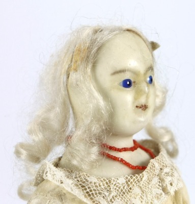 A wax over composition shoulder head doll, English 1840s, - 2