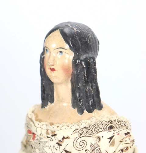A papier-mache shoulder head doll, German 1840s,