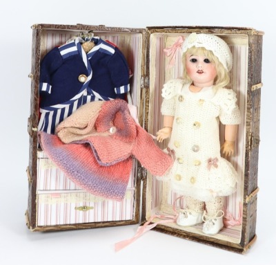 An S.F.B.J 60 bisque head doll with travel trunk, - 2