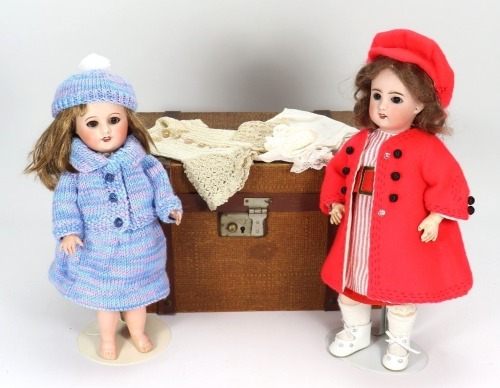 A Unis France 60 bisque head doll in trunk,