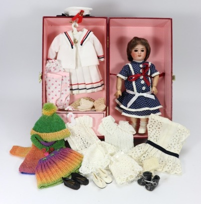 An S.F.B.J 60 Bleuette type bisque head doll in wardrobe,