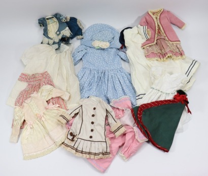 A selection of various dolls clothes,