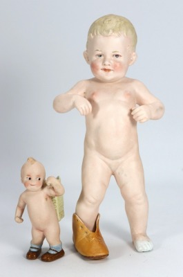 A bisque figurine of child playing in a shoe, German circa 1910,
