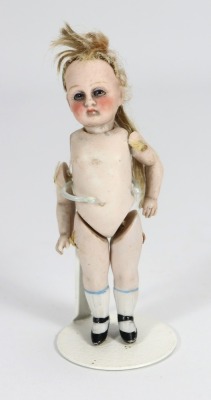 A miniature all bisque Kestner doll,