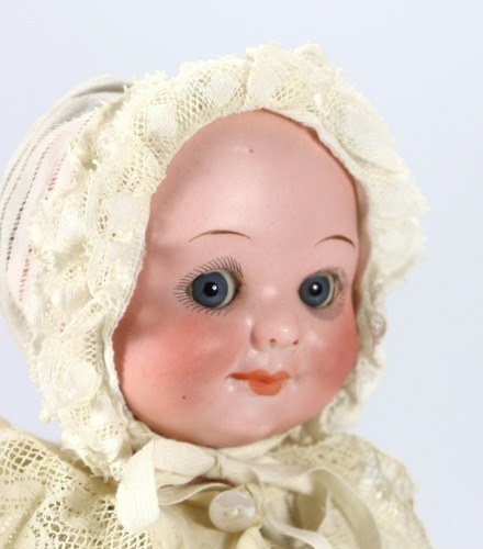 An A.M 323 bisque head &lsquo;googly&rsquo; doll, German circa 1910,