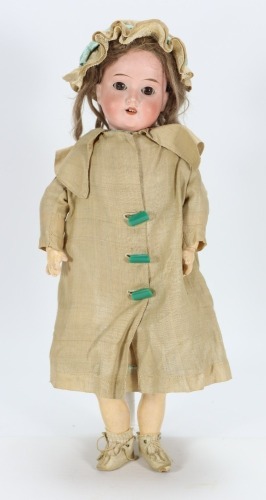 A Schoenau & Hoffmeister 1909 bisque head doll, German circa 1915,