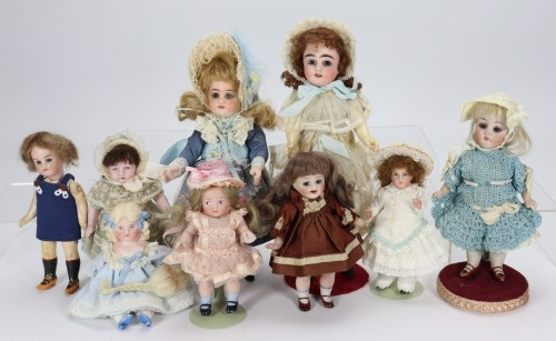 A group of nine various small and miniature German dolls,
