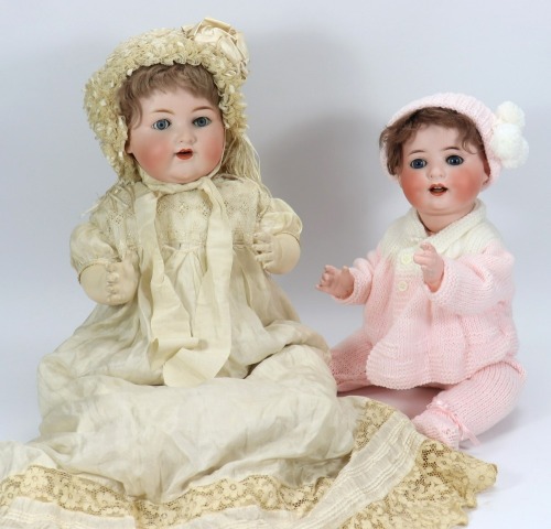A large A.M 990 bisque head baby doll in original box,