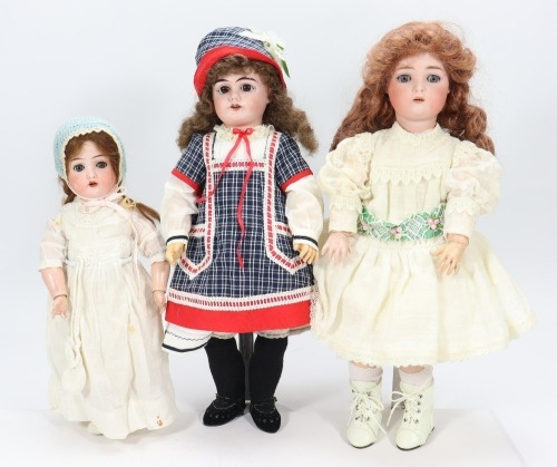 Three bisque head dolls,