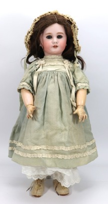A large DEP bisque head doll in original clothes, German for the French market, circa 1910
