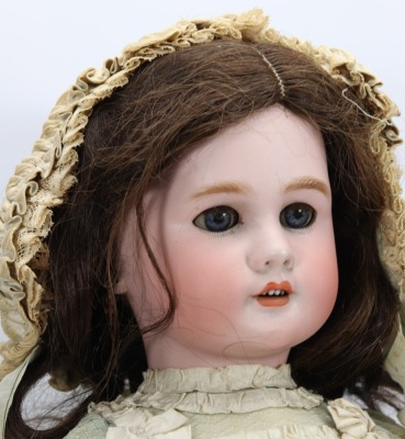 A large DEP bisque head doll in original clothes, German for the French market, circa 1910 - 2