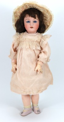 A Gebruder Kuhnlenz bisque head doll, German, (for the French market), circa 1910