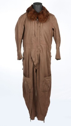 WW2 Japanese Winter Flight Suit, being dark brown one piece example with large fur collar. Half front zip with concealed button crutch. Fur lined knee pockets. Rear pocket and zip, also with zips to ankles. The suit shows wear, the fur lining to the inter