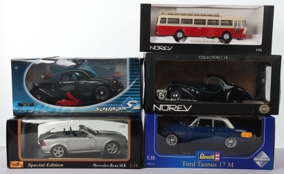 Four Boxed 1:18 Scale Models
