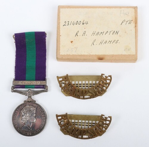 ERII General Service Medal to the Royal Hampshire Regiment with Malaya Clasp. Impressed to 23140064 Pte. R.A Hampton Royal Hampshire Regiment with its original box and pair of Royal Hampshire brass shoulder titles. (3)