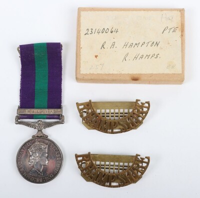 ERII General Service Medal to the Royal Hampshire Regiment with Malaya Clasp. Impressed to 23140064 Pte. R.A Hampton Royal Hampshire Regiment with its original box and pair of Royal Hampshire brass shoulder titles. (3)
