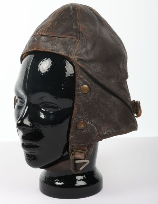 Early Second World War 1939 dated B Type leather flying helmet by Wareings (Northampton) Ltd, No.1 Size 6 1/2 to 6 3/4. With leather adjustable strap to rear. Oxygen mask studs, no ear cups have been attached. Leather chin strap with metal reinforcement.
