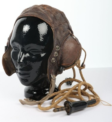 Second World War British B Type Flying Helmet in brown leather, with zipped ear cup pieces, chin strap and with original RAF Flying Helmet Internal Wiring Loom with jack plug RAF store code 10H/14206