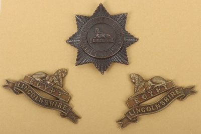 A set of Military Cap, Collar Badges Shoulder Titles & Buttons to the Lincolnshire Regiment - 5