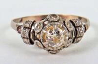 A Continental gold (unmarked) and diamond cluster ring