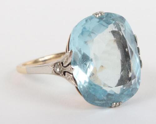 A large aquamarine, diamond, gold and platinum dress ring (marks ineligible)