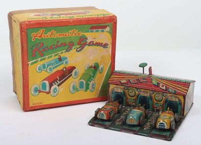 Haji (Japan) boxed tinplate Automatic Racing Game, 1950s, three racing cars and lithographed garage housing spring mechanism and plungers, place cars in front and push knob to release plungers and propel the cars, (good condition, box good).