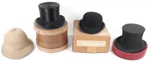 A selection of hats including a Victorian silk top hat with original box with label ‘James Bevan & Co’
