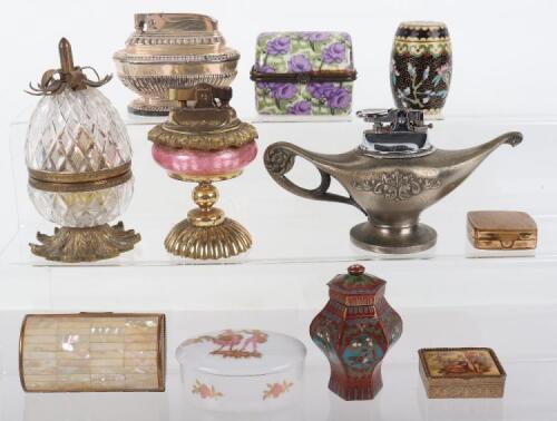 A mixed lot to include a selection of table lighters and pill boxes