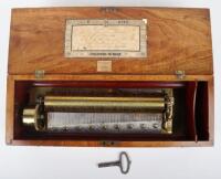 An early 20th century Swiss combed mahogany cylinder music box