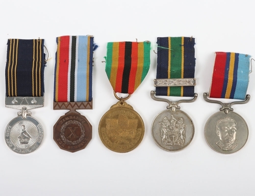 An Interesting Double Long Service Medal Group of 5 to a Sergeant in the Rhodesian Police Force who Continued to Service in the Zimbabwe Forces after Independence