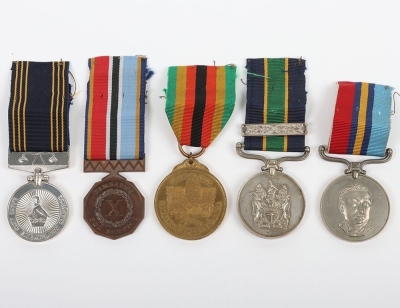 An Interesting Double Long Service Medal Group of 5 to a Sergeant in the Rhodesian Police Force who Continued to Service in the Zimbabwe Forces after Independence