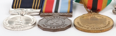 An Interesting Double Long Service Medal Group of 5 to a Sergeant in the Rhodesian Police Force who Continued to Service in the Zimbabwe Forces after Independence - 8