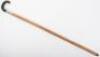 An Edwardian walking stick with spirit level and scaled ruler