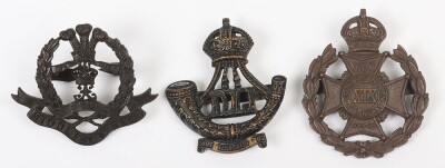 Grouping of Bronzed British Military Officer's Service Dress Cap Badges to Territorial Regiments.