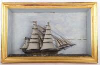 A cased diorama or shadowbox model of the ship HMS Monarch