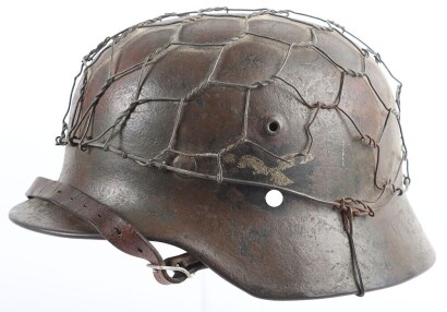 WW2 German Luftwaffe M40 Camouflaged Helmet with Wire Basket.