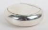 A Victorian silver circular &lsquo;squeeze&rsquo; sided box, London 1867
