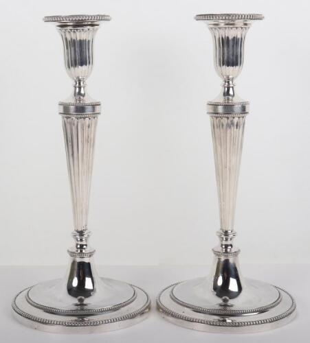 A pair of Victorian silver candlesticks, London 1880, Martin Hall & Co