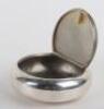 A Victorian silver circular &lsquo;squeeze&rsquo; sided box, London 1867 - 7