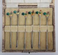 A set of six silver and enamel cocktail sticks, Albert Sydenham, Birmingham 1902