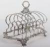 A Georgian silver toast rack, circa 1820 - 2
