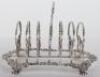 A Georgian silver toast rack, circa 1820 - 4