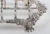A Georgian silver toast rack, circa 1820 - 5