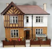 A Tudor style dolls house, English 1930s,